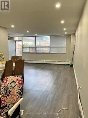 Hamilton (Vincent) condo for rent - A room with a window and a chair with a floral patterned cushion.