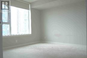 Toronto (Bendale) condo for rent - A large empty room with a window on the left side.