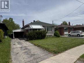 Toronto (Wexford-Maryvale) apartment for rent - A house with a car parked in front of it.