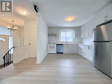 Toronto (Wexford-Maryvale) apartment for rent - A kitchen with white cabinets and a stainless steel refrigerator.