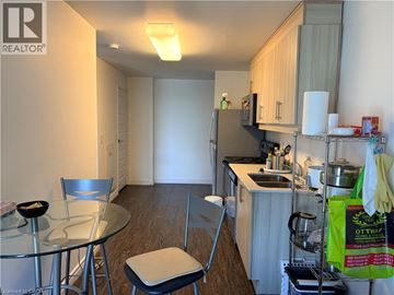 Waterloo condo for rent - A kitchen with a table and chairs.