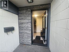 Cambridge townhouse for rent - A doorway with a black mat in front of it.