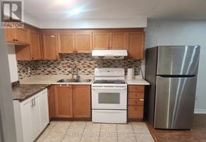Brampton (Fletcher's Creek South) apartment for rent - A kitchen with a stove, sink, and refrigerator.