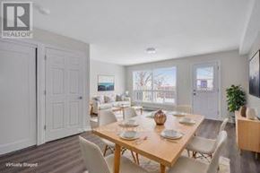 Ottawa townhouse for rent - A dining room with a wooden table set for six.
