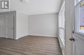 Ottawa townhouse for rent - A room with wooden flooring and white walls.