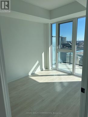 Toronto (Regent Park) house for rent - A room with a view of the city through large windows.