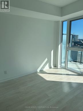 Toronto (Regent Park) house for rent - A room with a large window and wooden flooring.