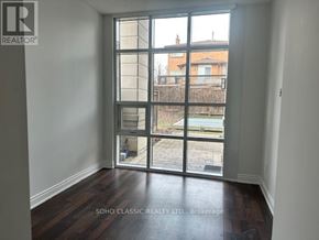 Vaughan (Maple) condo for rent - A room with a large window overlooking a backyard.