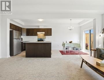 Fort Erie (Crescent Park) townhouse for rent - A spacious kitchen with a dining table set for four.