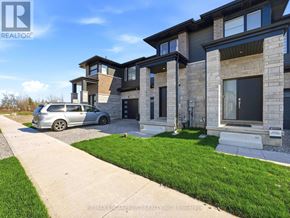 Fort Erie (Crescent Park) townhouse for rent - A modern house with a grey car parked in front.