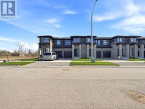 Fort Erie (Crescent Park) townhouse for rent - A building with the sign REALTOR in the corner.