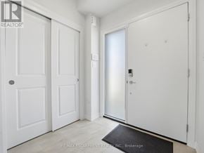 Fort Erie (Crescent Park) townhouse for rent - A white door with a black mat in front of it.