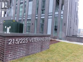 Brampton (Northwest Brampton) condo for rent - A brick wall with the number 215225 Veterans Drive on it.