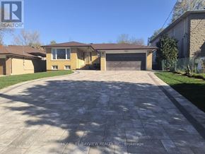 Markham (Grandview) apartment for rent - A driveway leads to a garage in front of a house.
