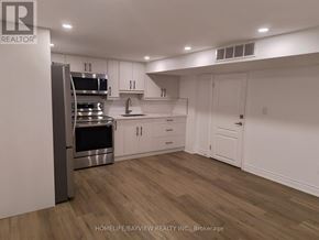 Markham (Grandview) apartment for rent - A modern kitchen with wooden floors and white walls.