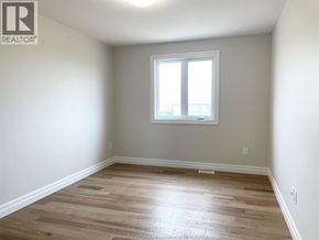 Essex townhouse for rent - A room with a window and wooden flooring.