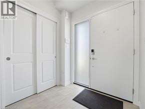 Fort Erie townhouse for rent - A white door with a black mat in front of it.