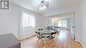 Mississauga (Erin Mills) apartment for rent - A well-lit, spacious room with a dining table and chairs.