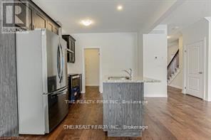 London North (North S) apartment for rent - A kitchen with a refrigerator and a counter top.