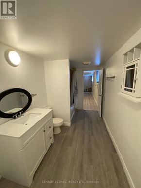 Cornwall apartment for rent - A bathroom with a white sink and a mirror.