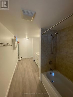 Cornwall apartment for rent - A bathroom with a tub and a walk in shower.