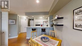 Toronto (Waterfront Communities) condo for rent - A dining room with a table set for two.