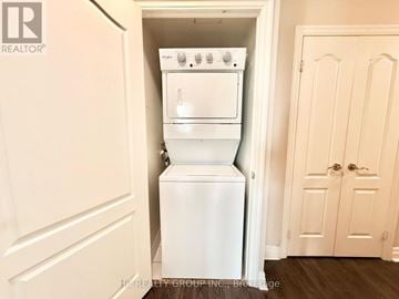 Toronto (Willowdale East) condo for rent - A white oven and dishwasher are built into a wall in a kitchen.