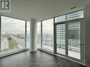 Vaughan (Vaughan Corporate Centre) condo for rent - A room with a view of a highway and buildings outside the window.