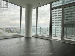 Vaughan (Vaughan Corporate Centre) condo for rent - A room with a view of the cityscape through large windows.