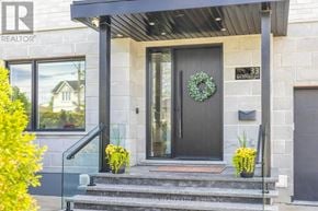 Toronto (Maple Leaf) apartment for rent - A house entrance with a wreath on the door and a garage door to the right.