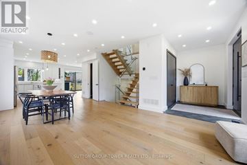 Toronto (Maple Leaf) apartment for rent - A spacious living room with a dining table and chairs.