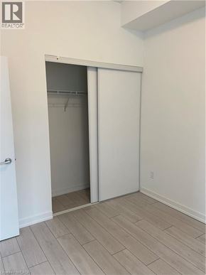 Kitchener condo for rent - A white door with a glass window is open.