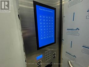 Toronto (Newtonbrook East) condo for rent - A sign with numbers 1 to 36 displayed on a screen.
