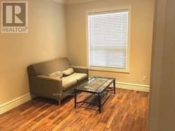 Toronto (South Riverdale) apartment for rent - A living room with a couch and a coffee table.