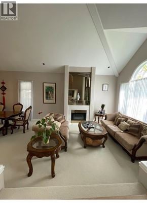 Richmond apartment for rent - A living room with a fireplace and a couch.