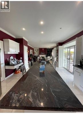 Richmond apartment for rent - A kitchen with a long counter top and a refrigerator.