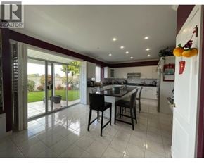 Richmond apartment for rent - A kitchen with a table and chairs in the middle of the room.