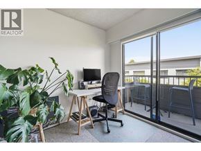 Vancouver apartment for rent - A room with a desk, chair, and a plant.