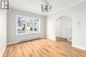 St. John's apartment for rent - A room with a large window and wooden flooring.