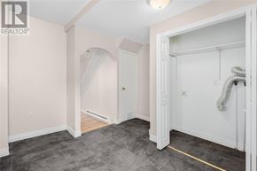 St. John's apartment for rent - A room with a grey floor and a white door.