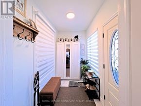 Toronto (O'connor-Parkview) apartment for rent - A hallway with a bench and a doorway leading to another room.