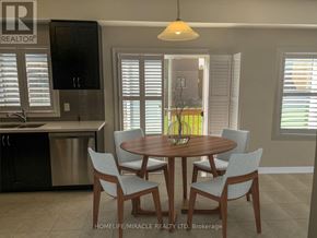 Brant (Paris) apartment for rent - A dining room with a table set for four.