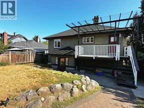 North Vancouver apartment for rent - A house with a stone wall in front of it.