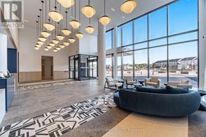 Burlington (Alton) condo for rent - A realtor's office with a large window overlooking a parking lot.
