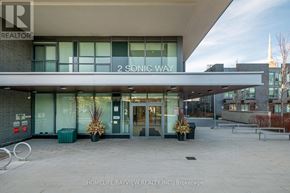 Toronto (Flemingdon Park) condo for rent - The front of a building with the words "2 Sonic Way" on it.