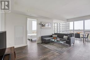 Toronto (Flemingdon Park) condo for rent - A living room with a couch, coffee table, and television.