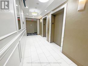 Markham (Unionville) condo for rent - A hallway with white walls and tiled floors.