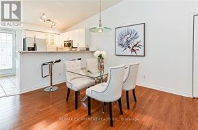 Burlington (Palmer) condo for rent - A dining room with a white table and chairs.