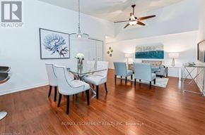 Burlington (Palmer) condo for rent - A living room with a dining table and chairs.