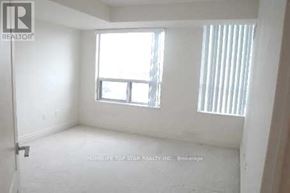Toronto (Bendale) condo for rent - A room with a window and a door is for sale.